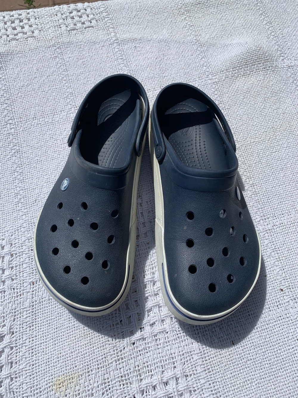 Adult unisex classic Crocs slip on shoes.    Blue with white trim, size 10M/12W.